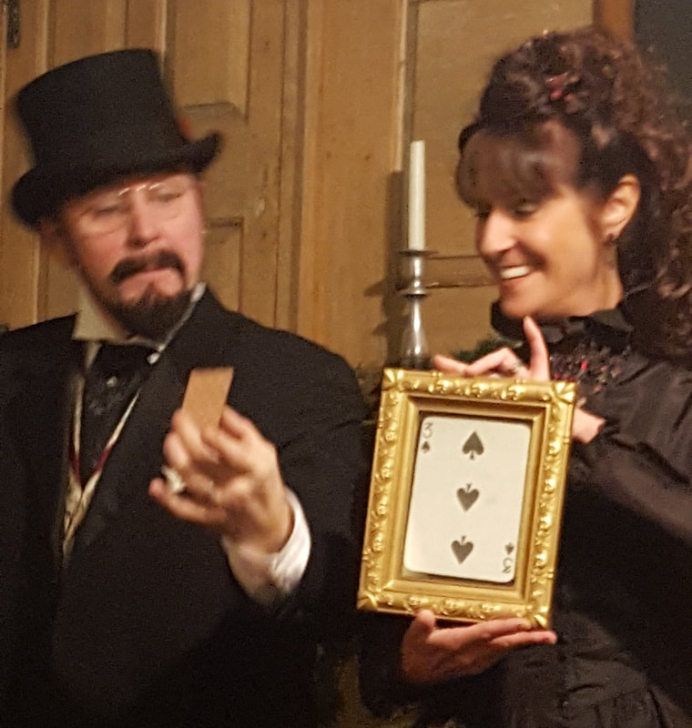 Angelique and Markus with a card revelation in their magic show at Strawbery Banke Museum